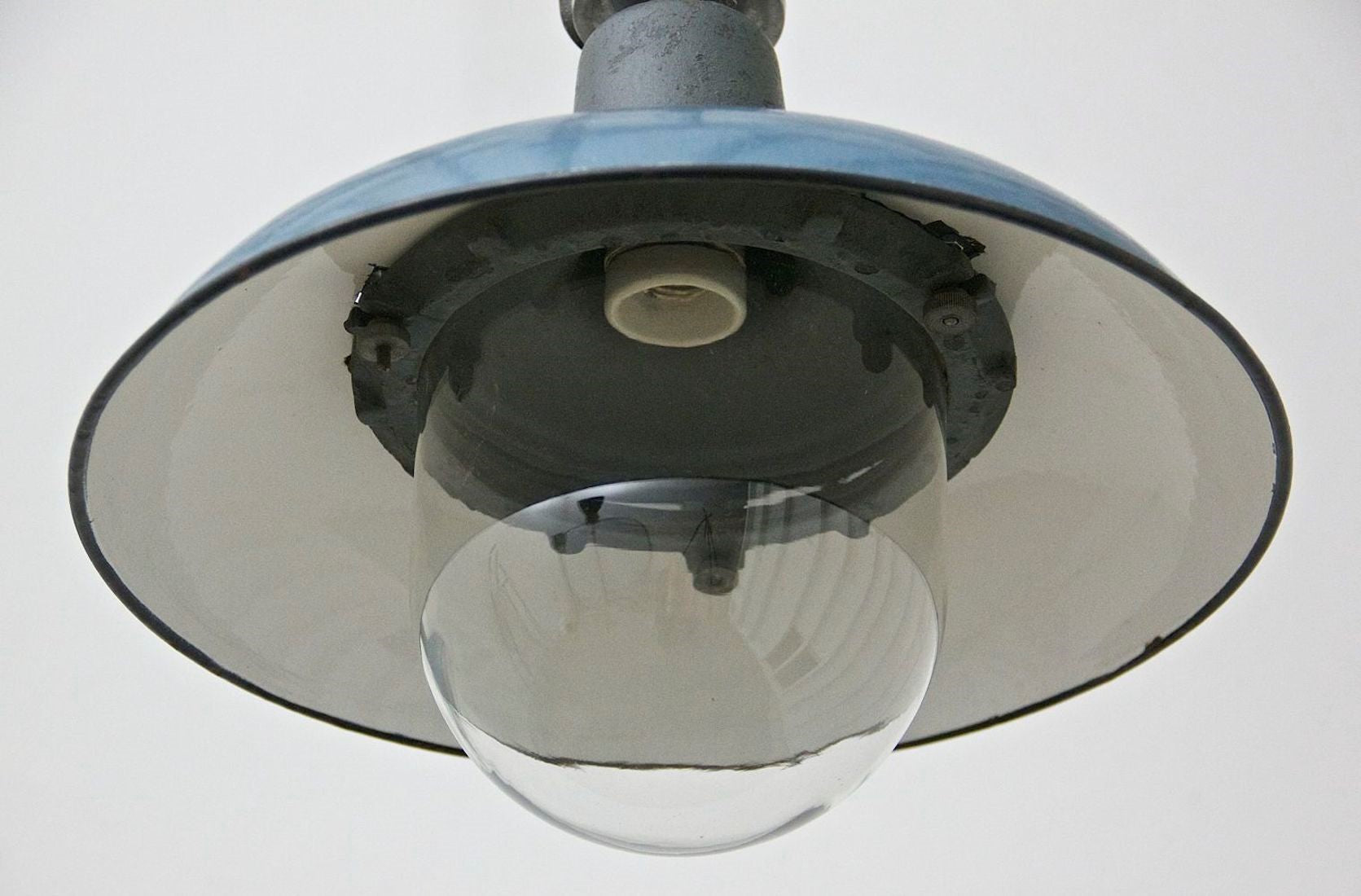 A blue enamelled pendant light (one remaining)