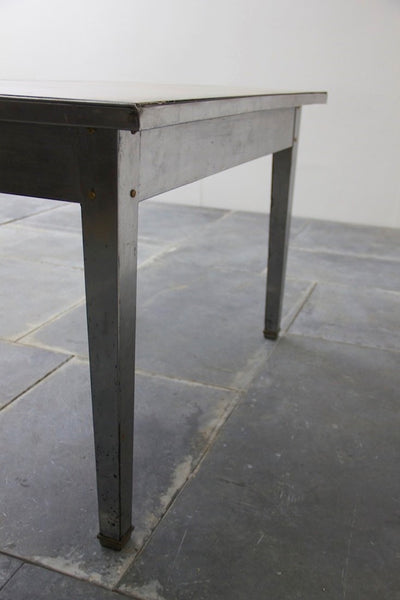 A 1940's brass and steel desk