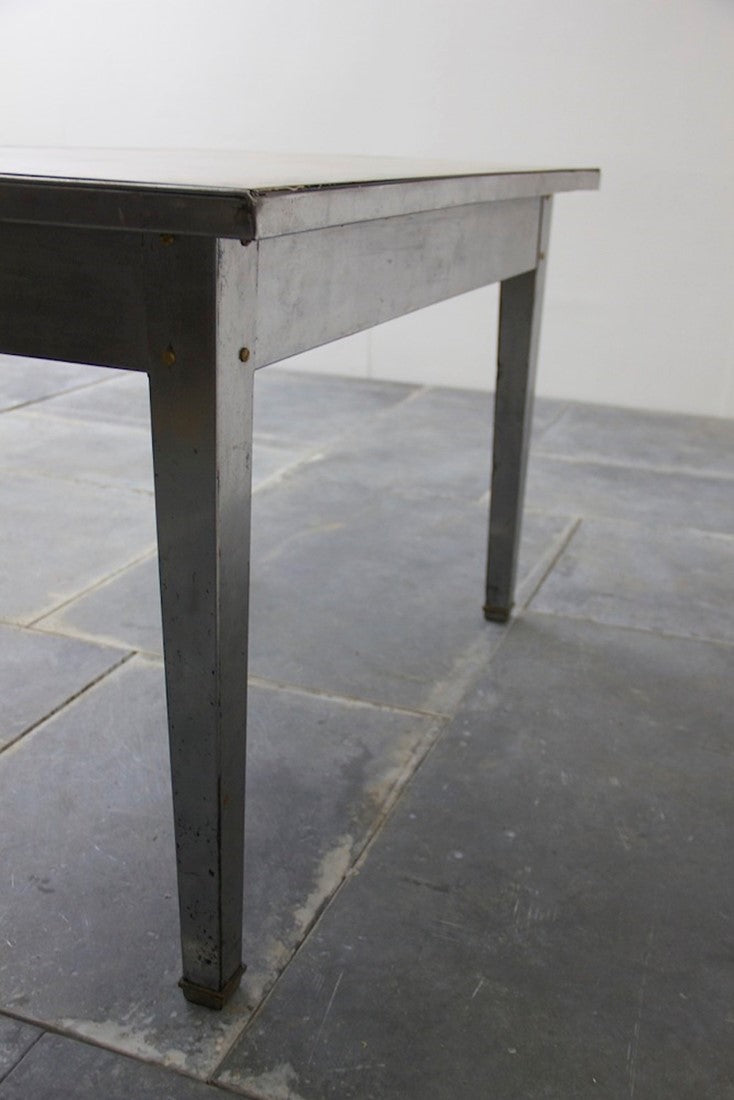 A 1940's brass and steel desk
