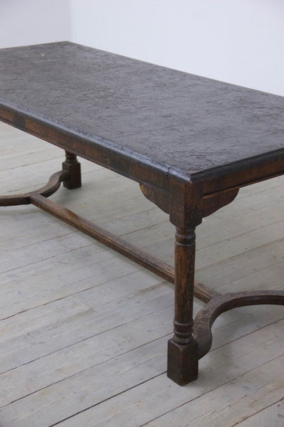 A heavily patinated oak table