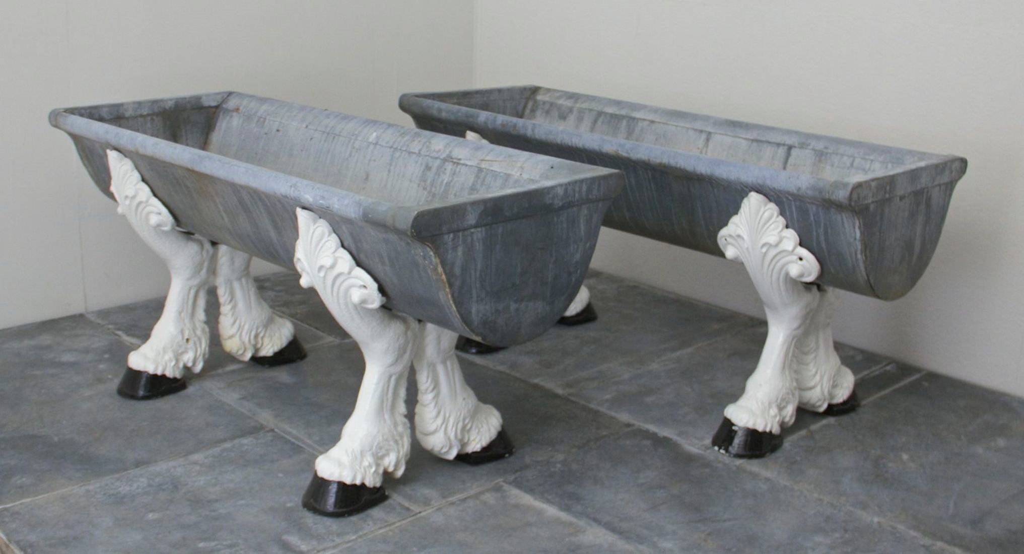 A pair of c19th drinking troughs