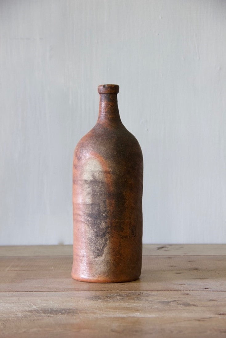 A set of ten clay bottles