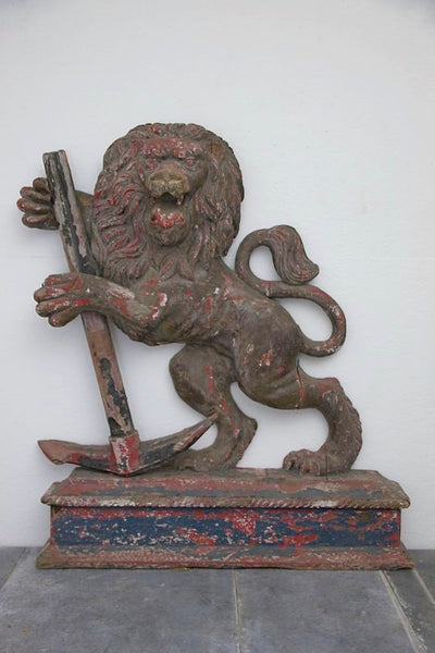 A C19th carved wood lion and anchor