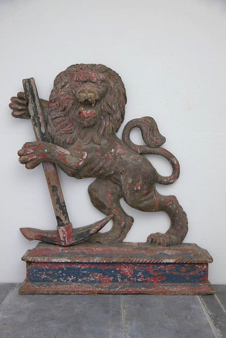 A C19th carved wood lion and anchor
