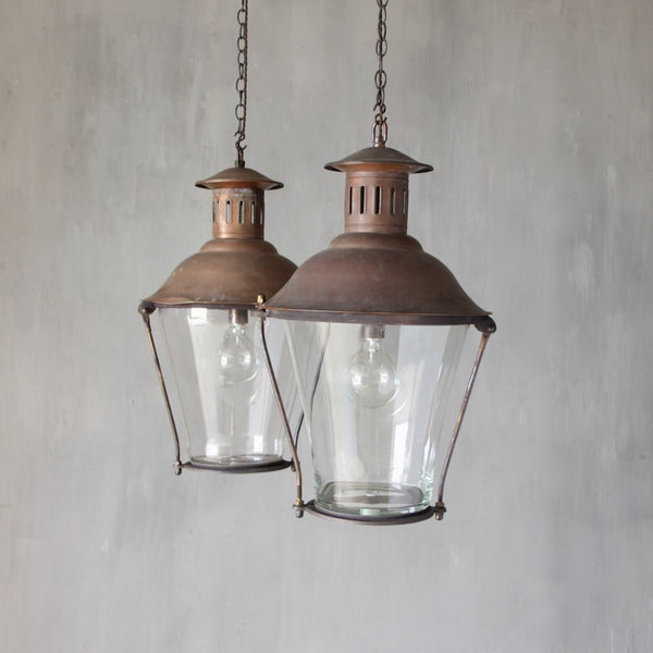 A pair of cylindrical copper lanterns
