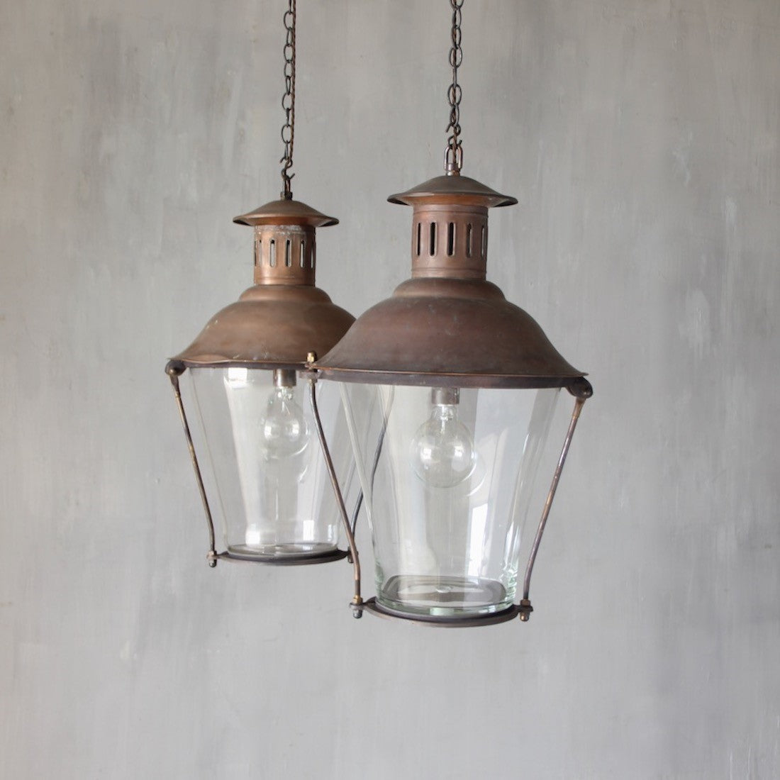A pair of cylindrical copper lanterns