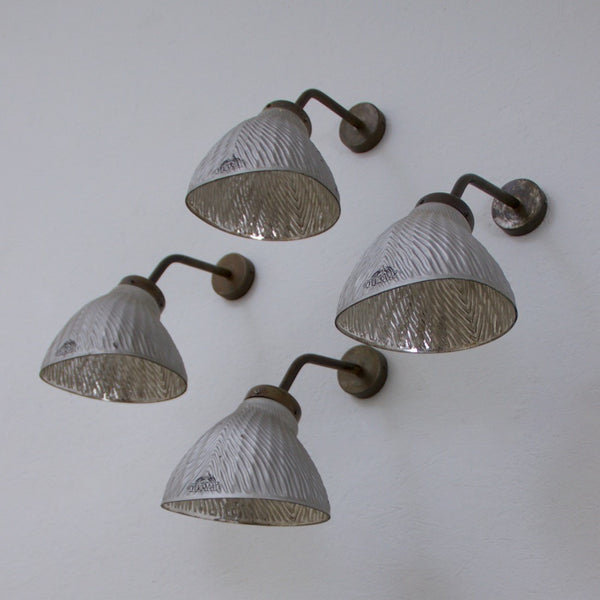 A set of 4 mirrored wall lights
