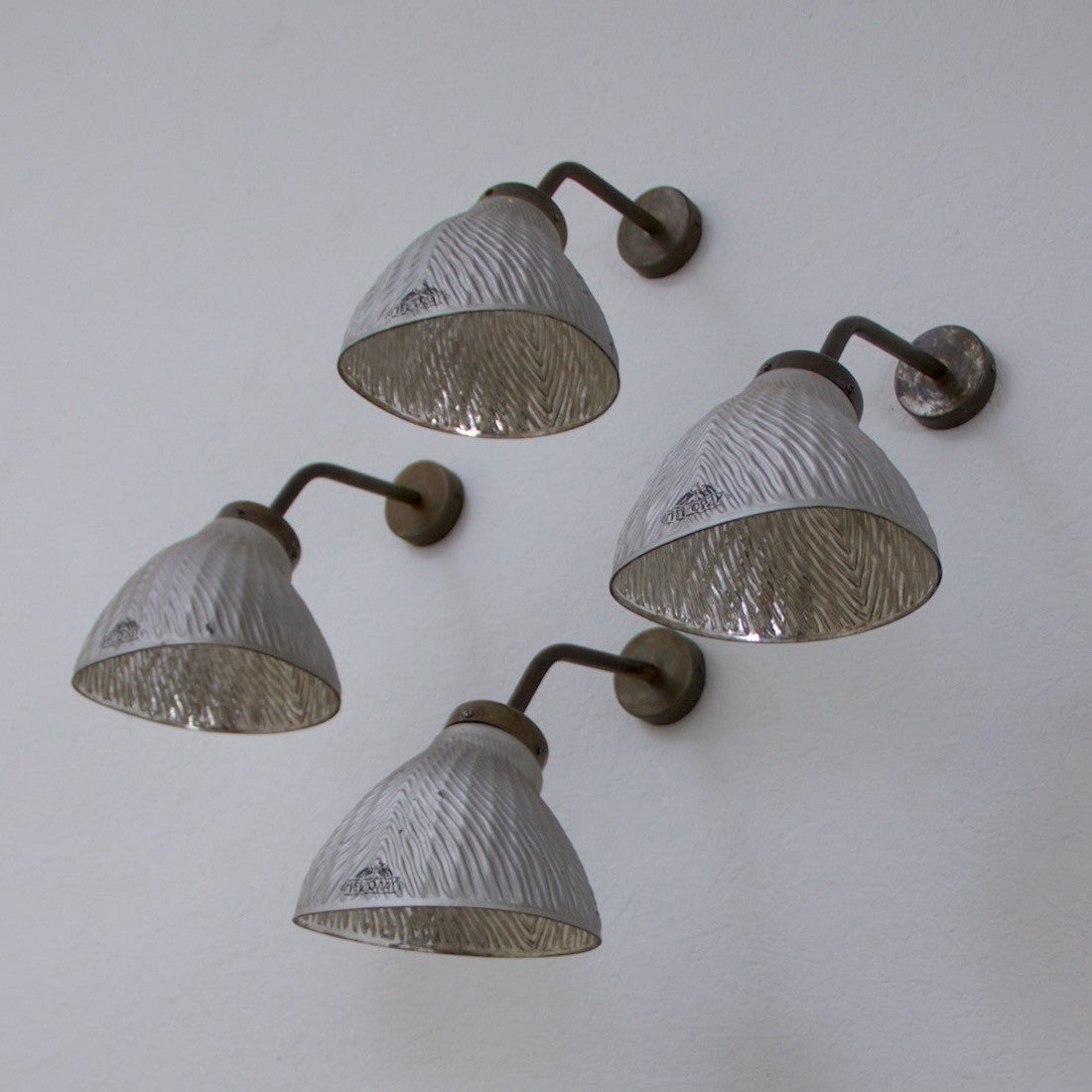 A set of 4 mirrored wall lights