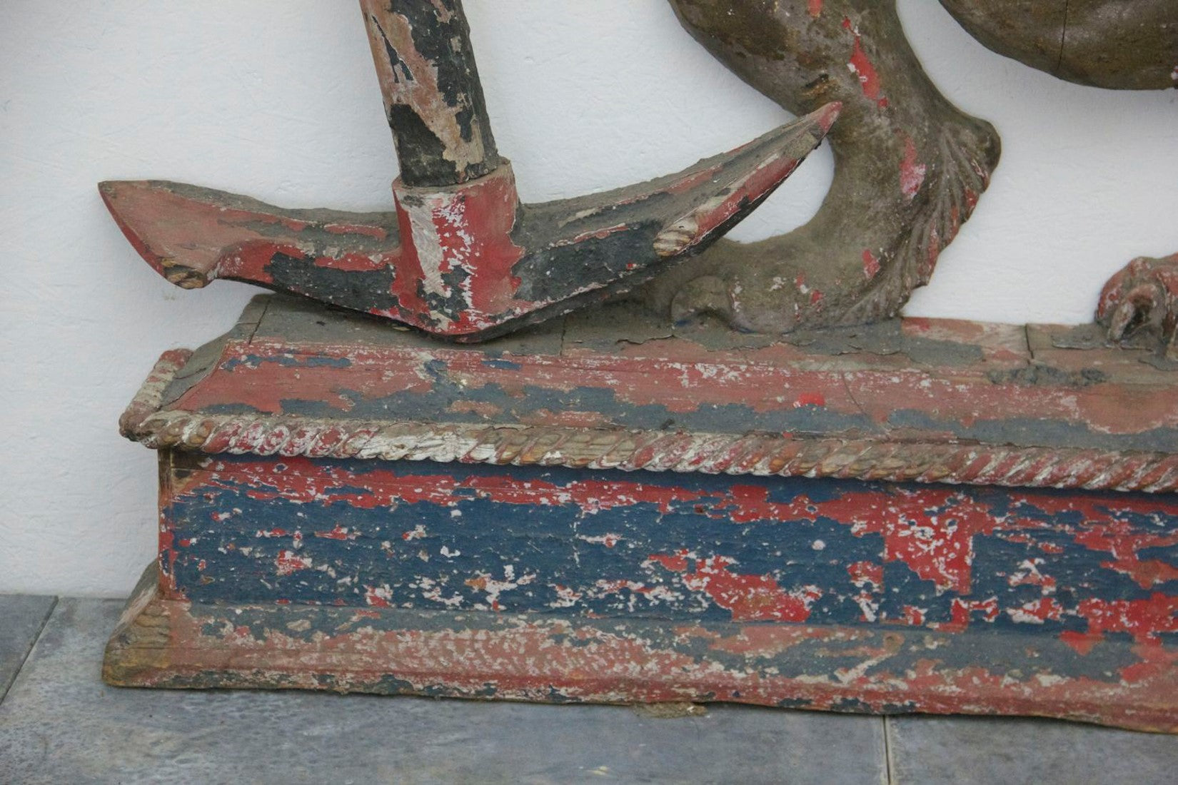 A C19th carved wood lion and anchor