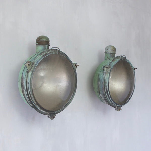 A 1920s pair of copper Holophane wall lights