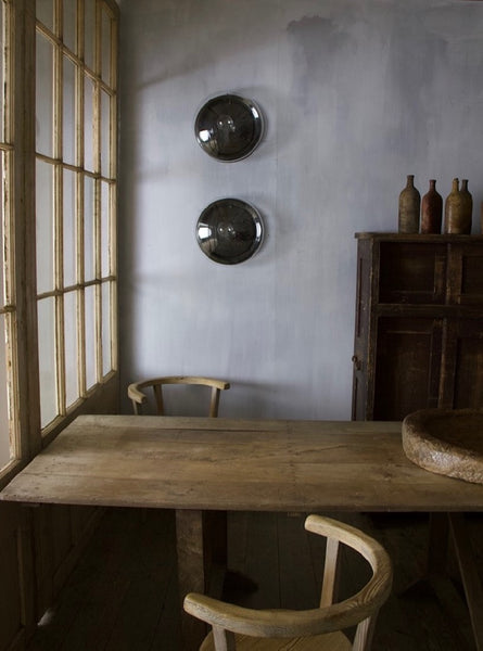 A large pair of glass wall lights