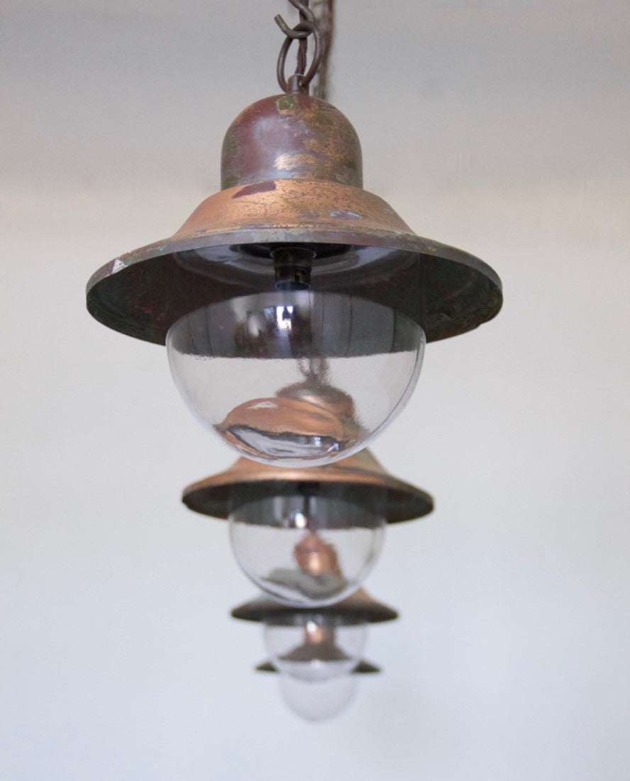 A set of 5 copper pendant lights