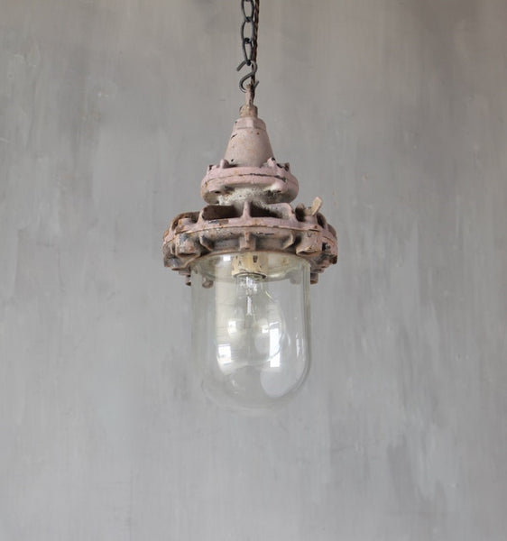 A set of three small industrial pendant lights