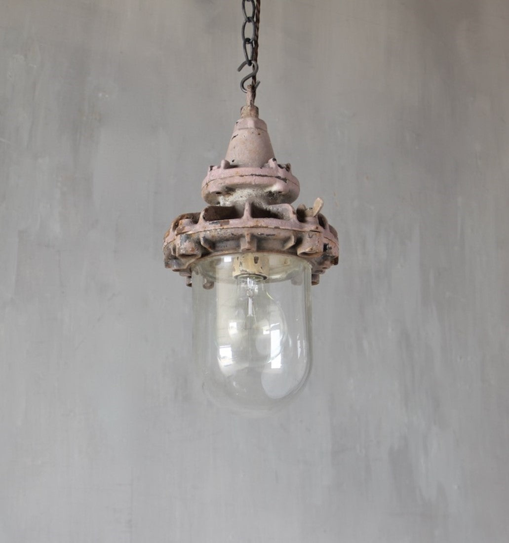 A set of three small industrial pendant lights