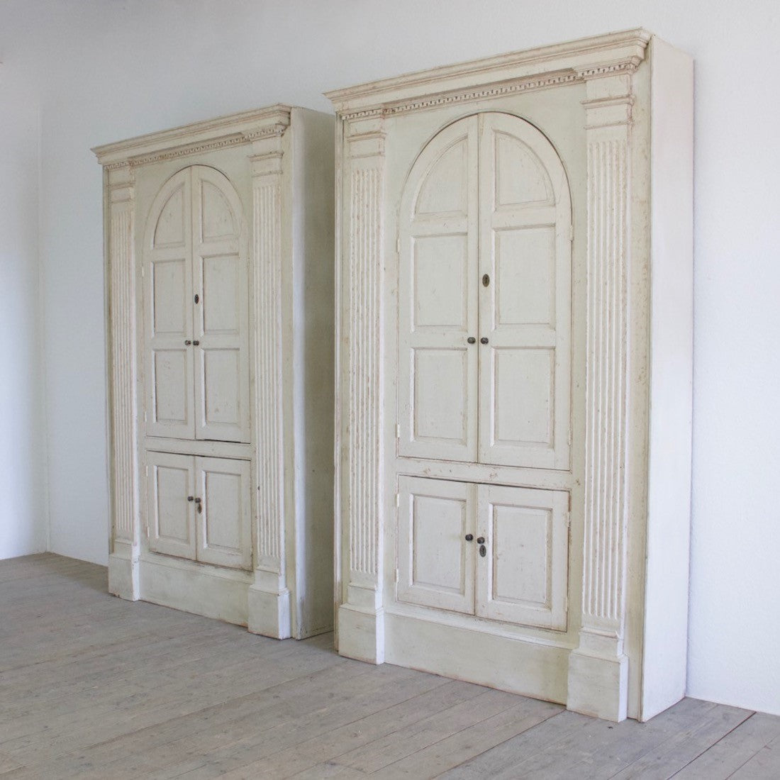 A pair of C18th cupboards