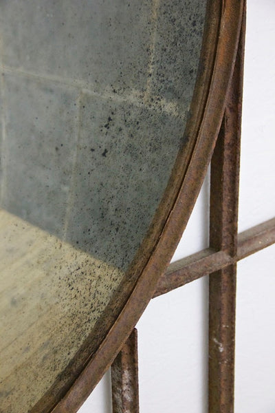 A large C19th wrought iron convex mirror