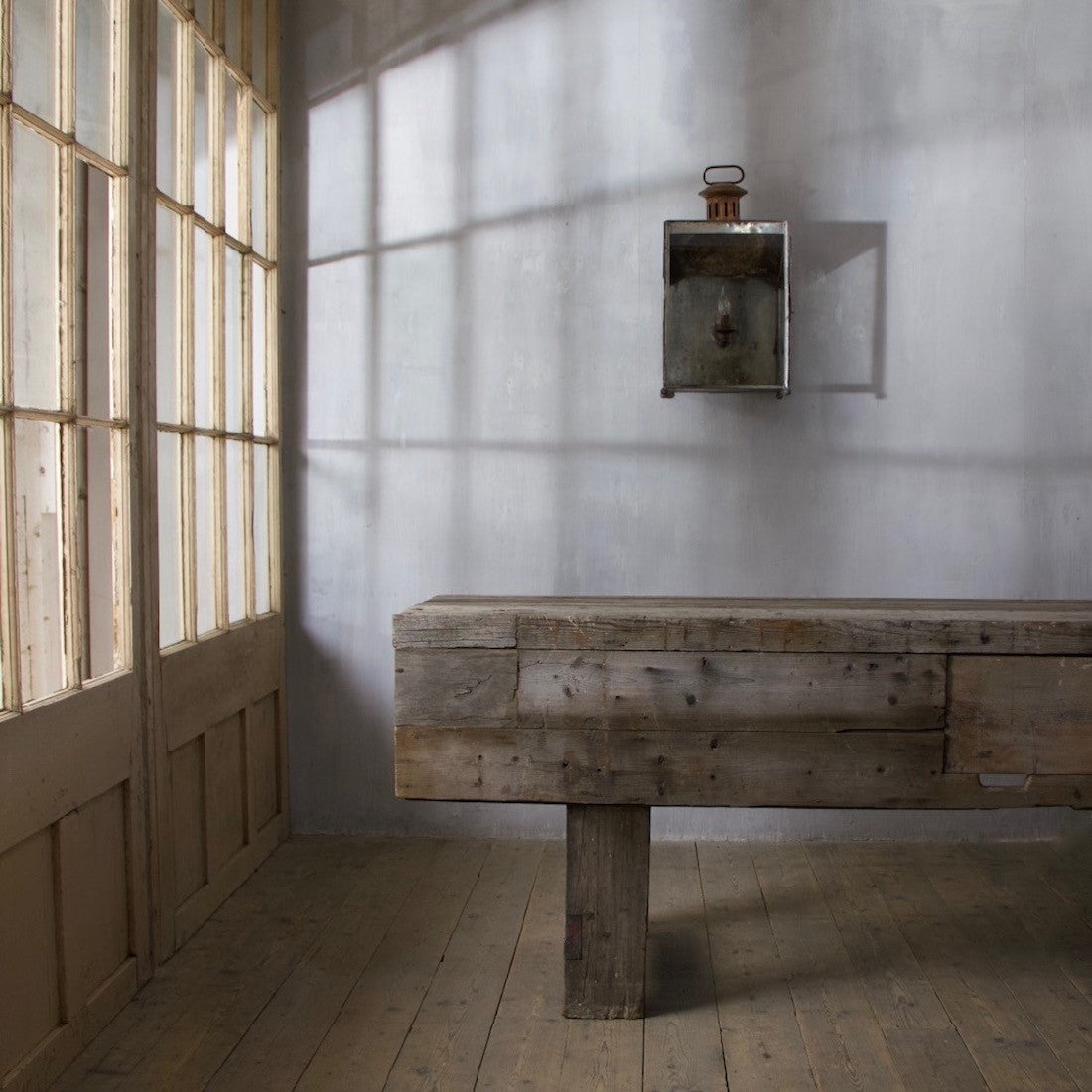 A large weathered work table