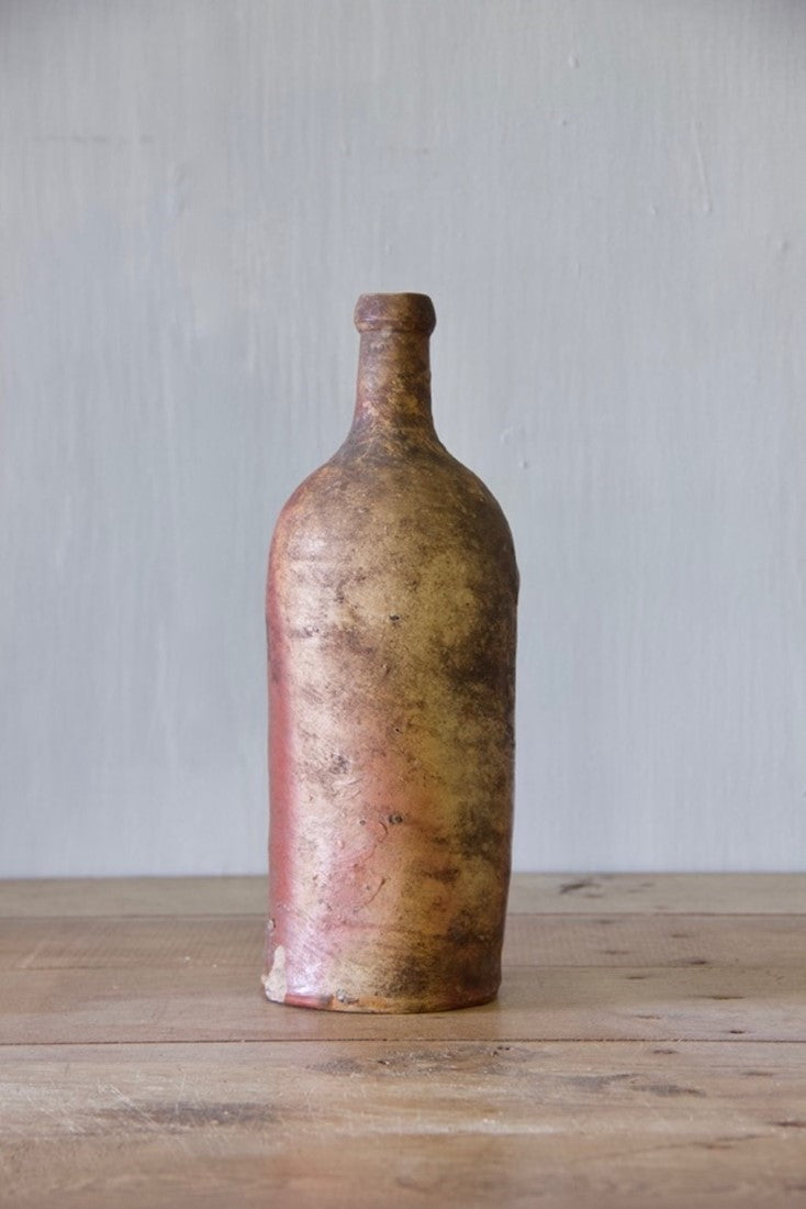 A set of ten clay bottles