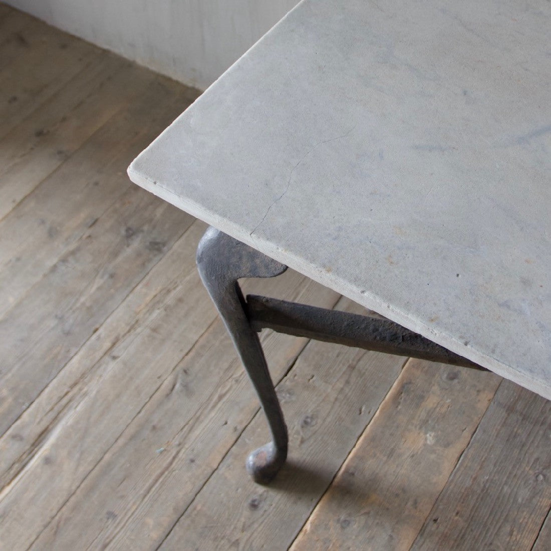 An iron and marble console table