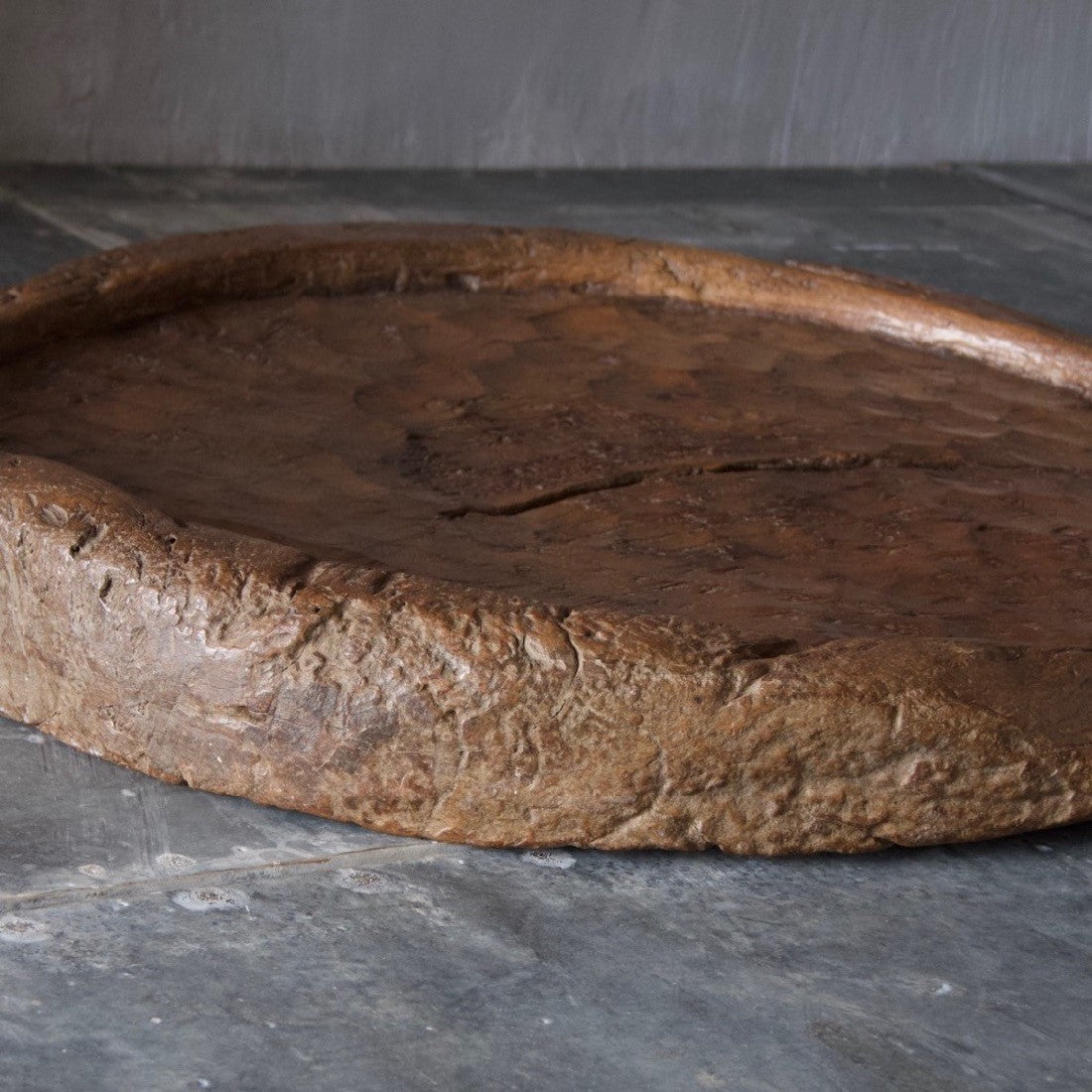 A very large wooden plate