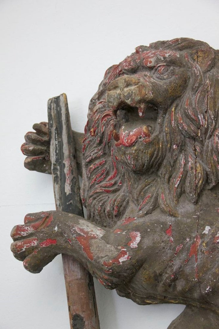 A C19th carved wood lion and anchor