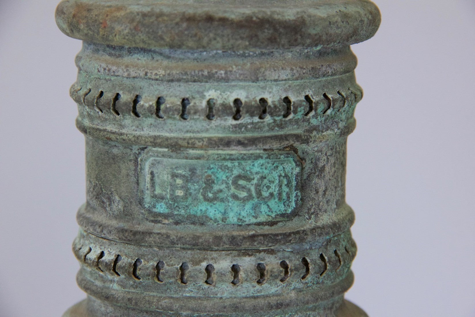 A pair of verdigris copper pendant lights