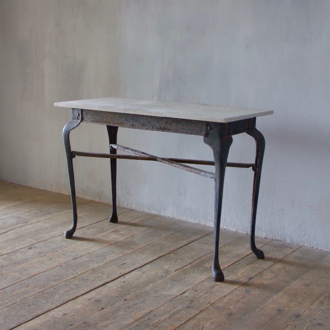 An iron and marble console table