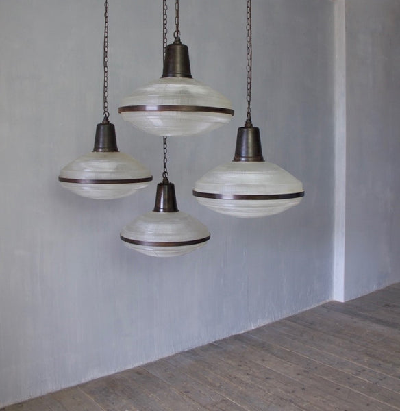 A set of 5 large Holophane pendant lights