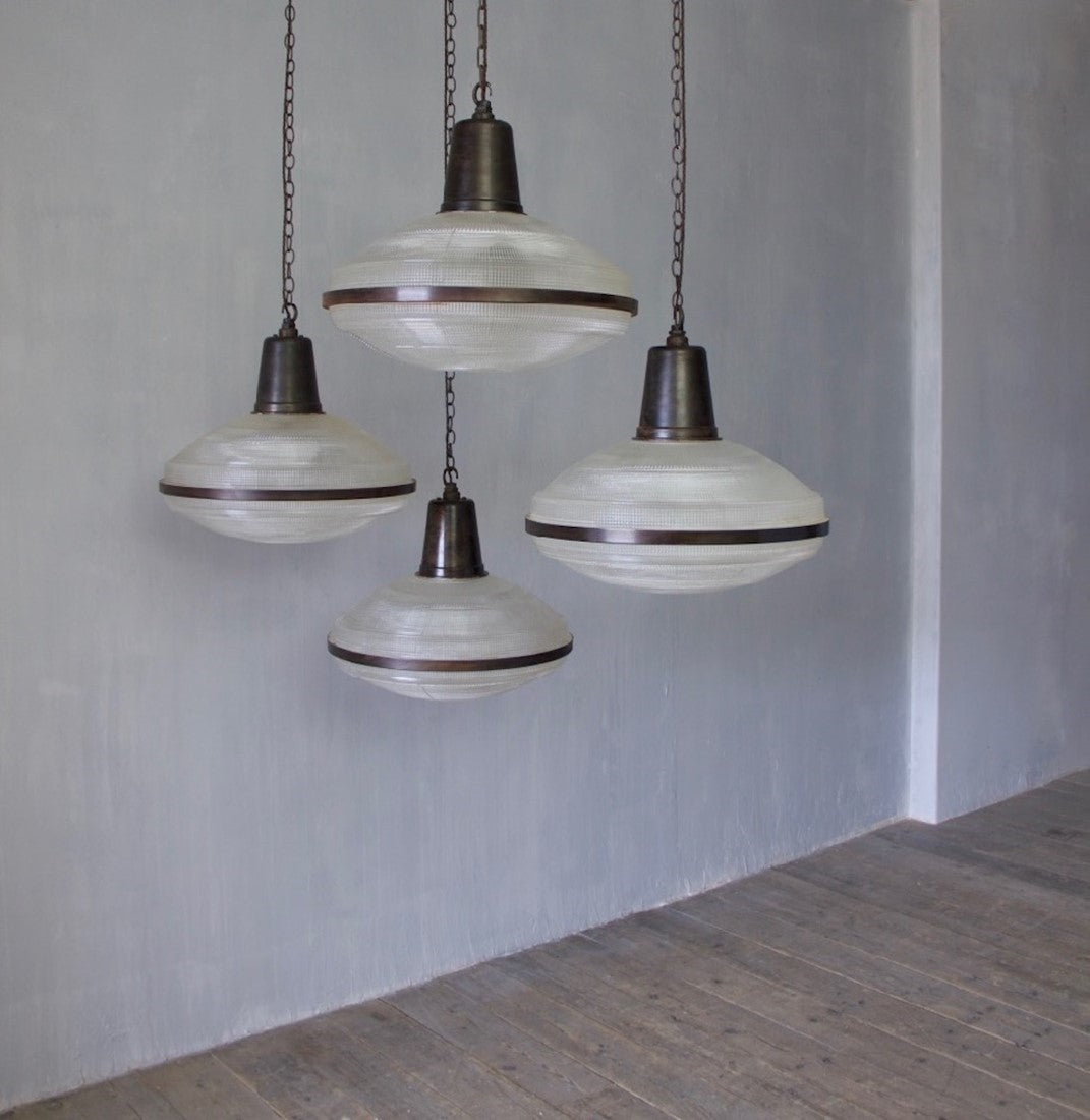 A set of 5 large Holophane pendant lights