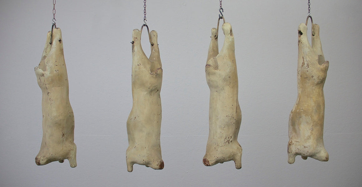 A set of 4 papier-mâché lamb carcasses