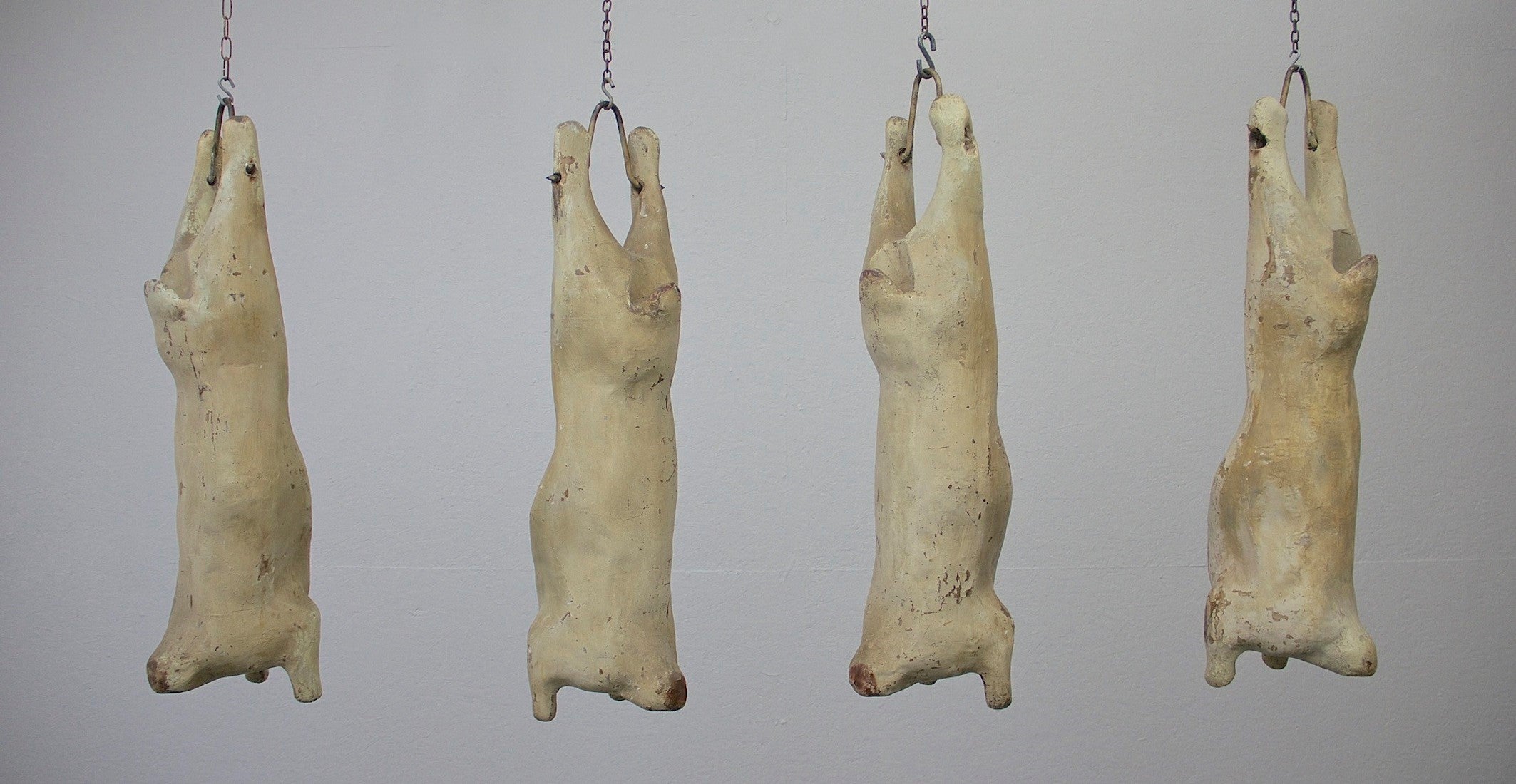 A set of 4 papier-mâché lamb carcasses