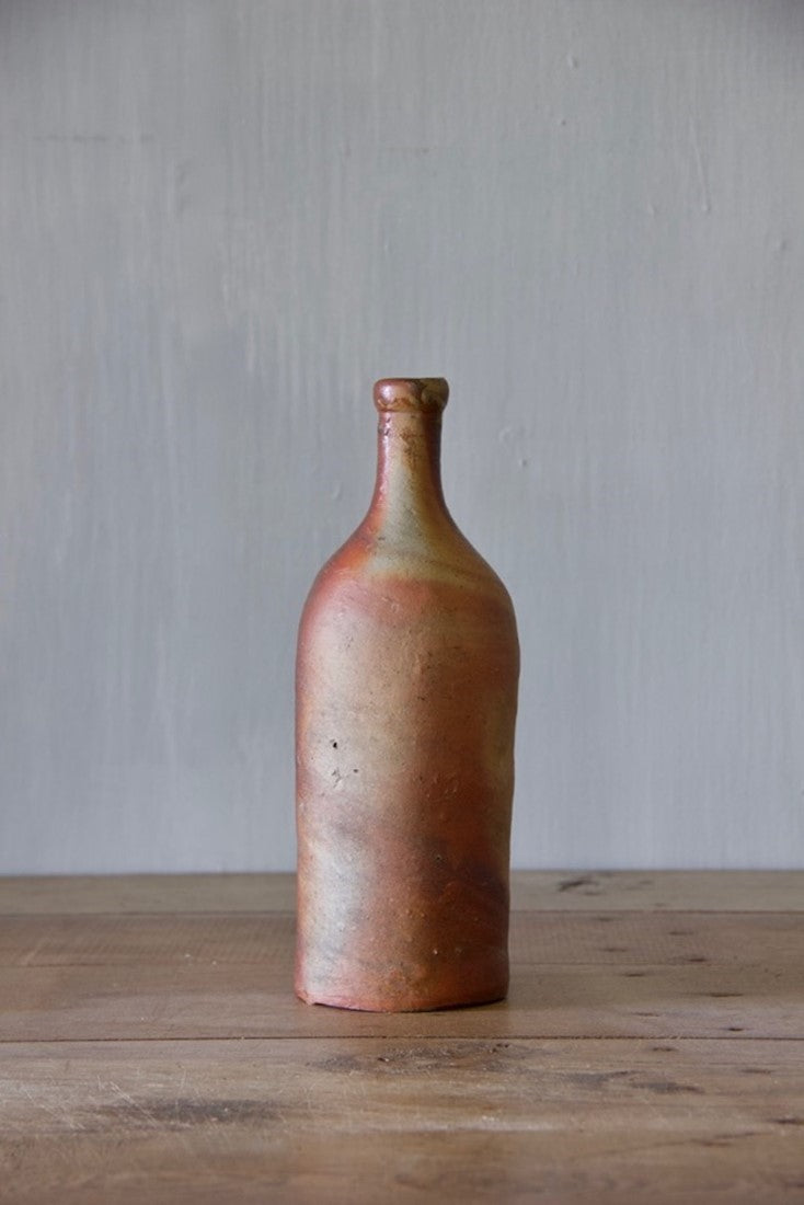 A set of ten clay bottles