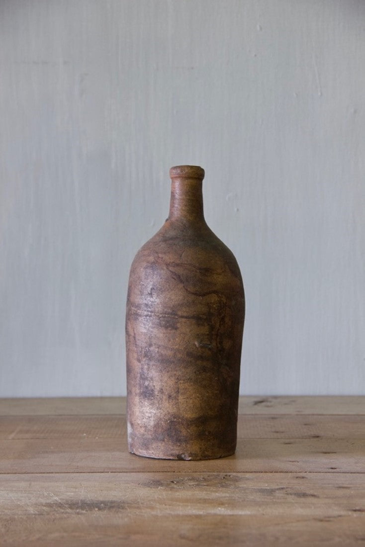 A set of ten clay bottles