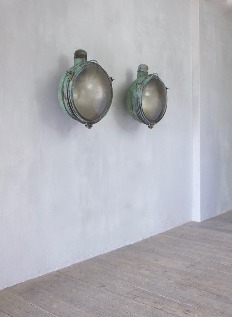A 1920s pair of copper Holophane wall lights