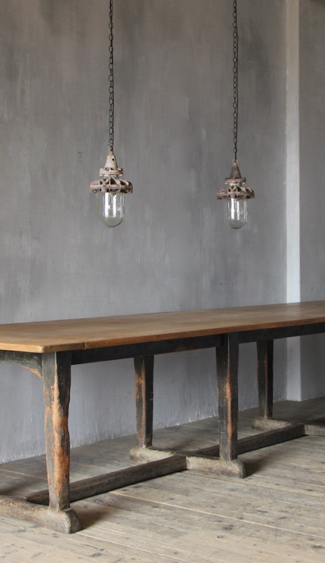 A set of three small industrial pendant lights