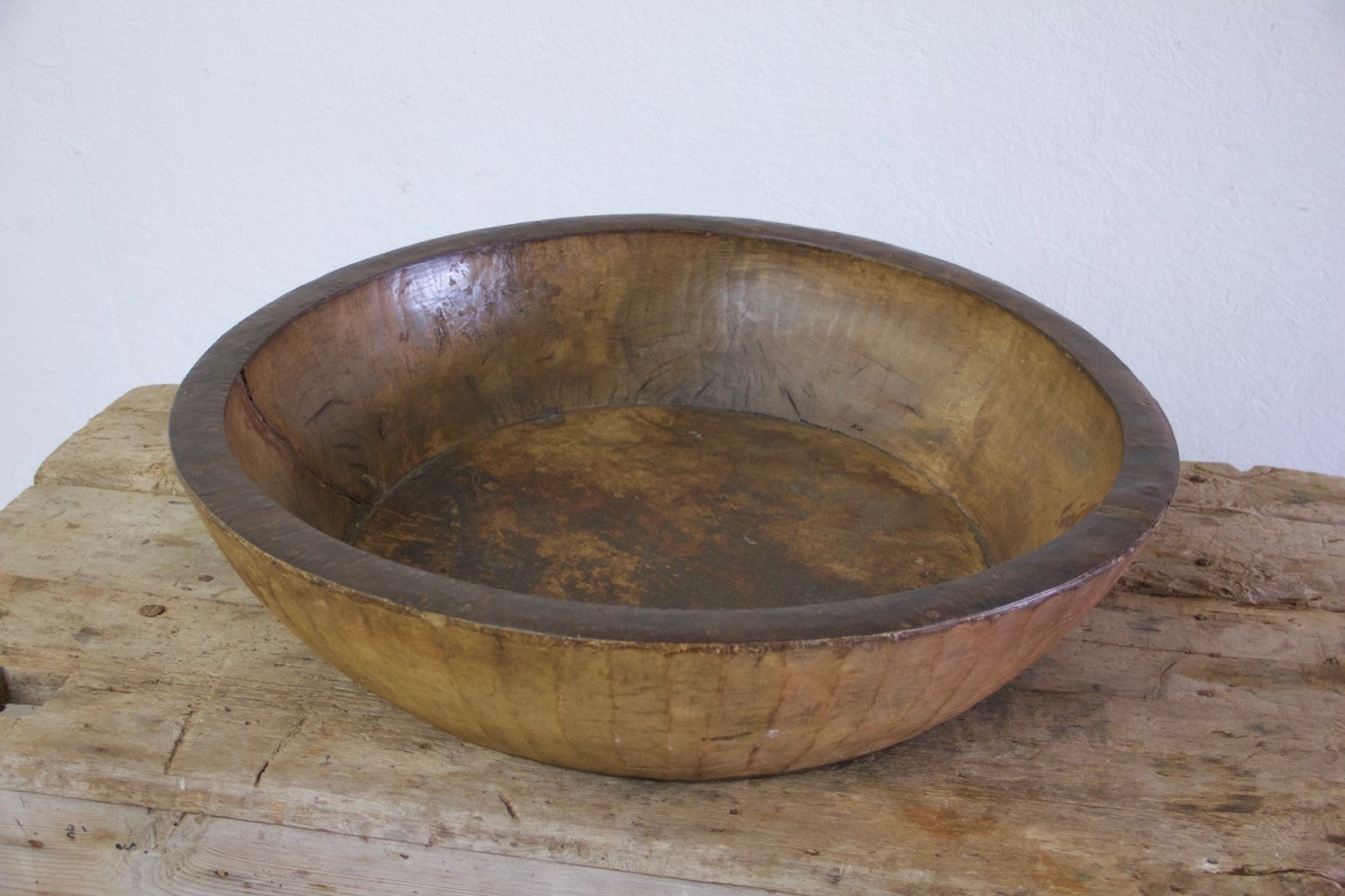 An oversized wooden bowl