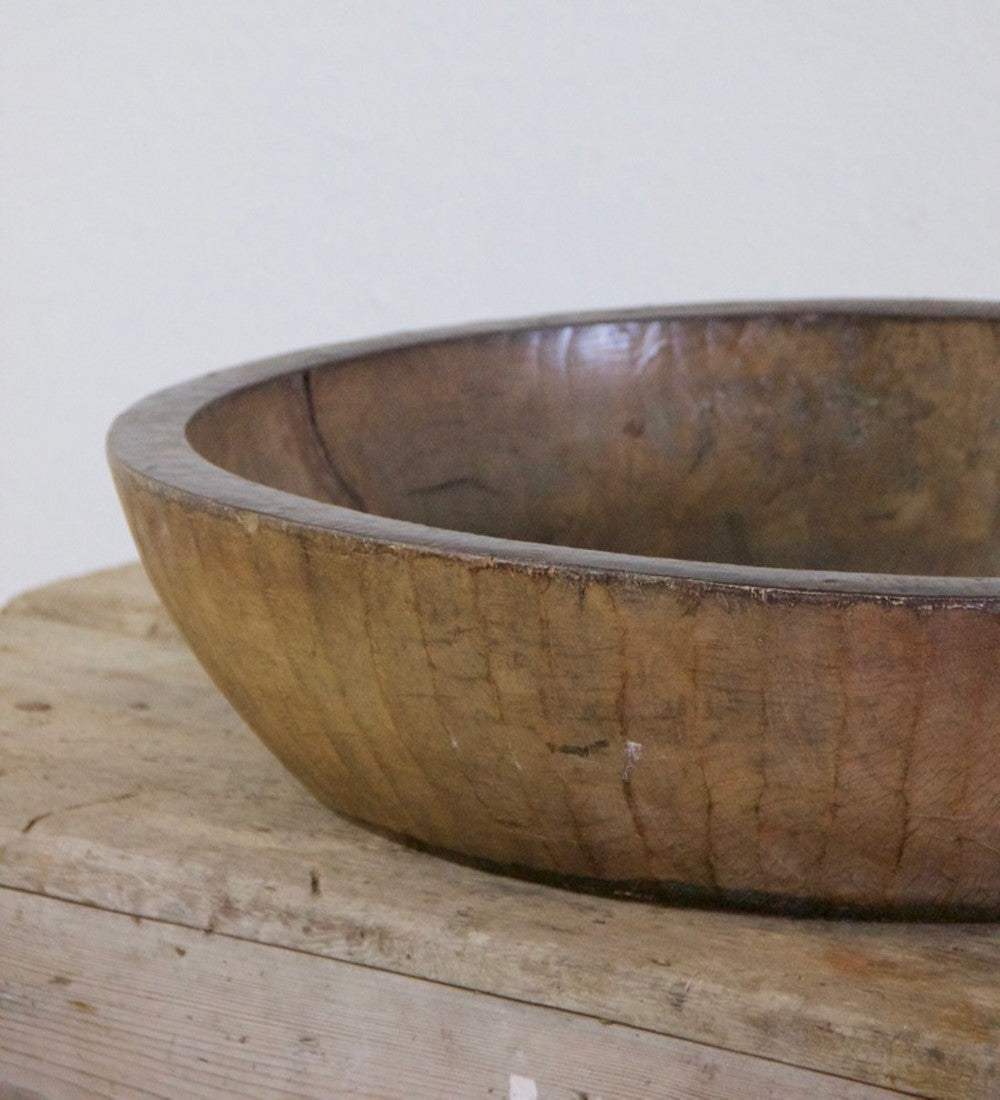 An oversized wooden bowl