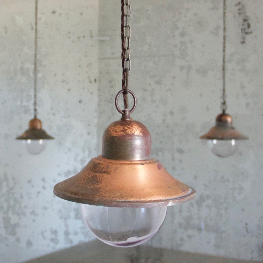 A set of 5 copper pendant lights