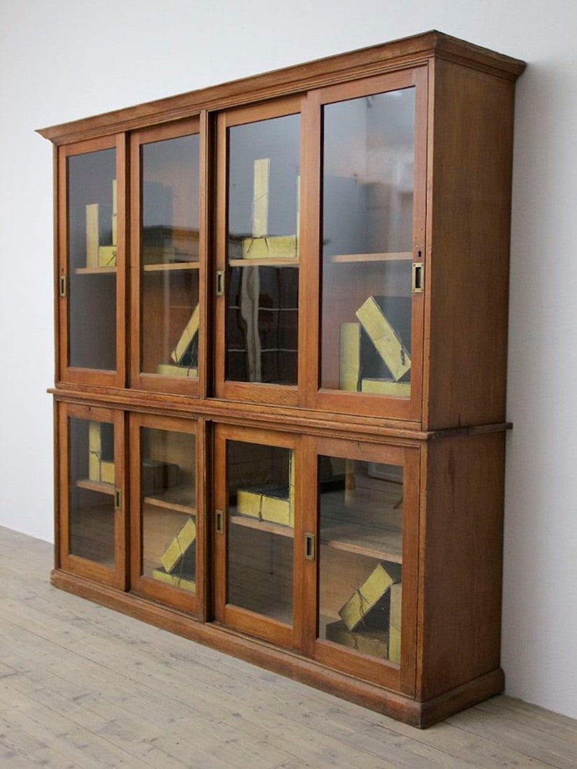 A C19th glazed pine cabinet