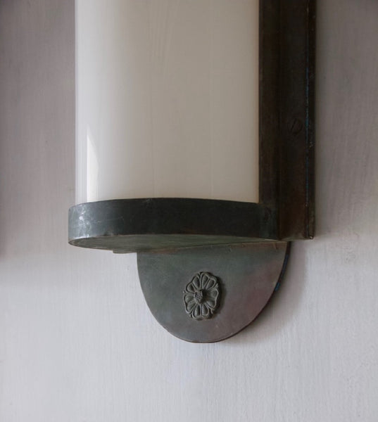 A pair of large bronze wall lanterns