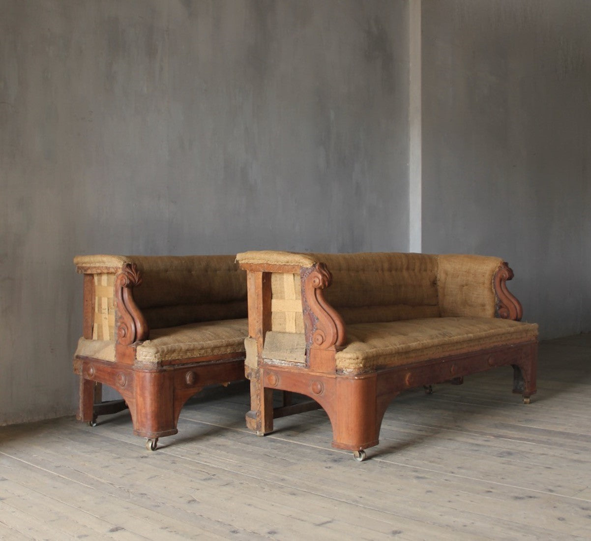 A pair of 19th century sofas from Penrhyn castle, Wales