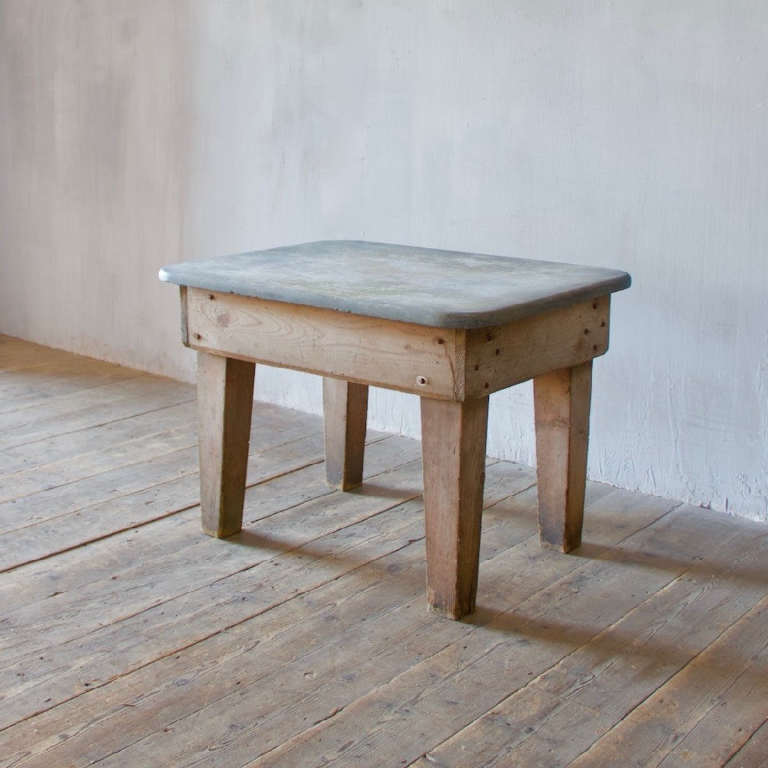 A primitive estate-made side table