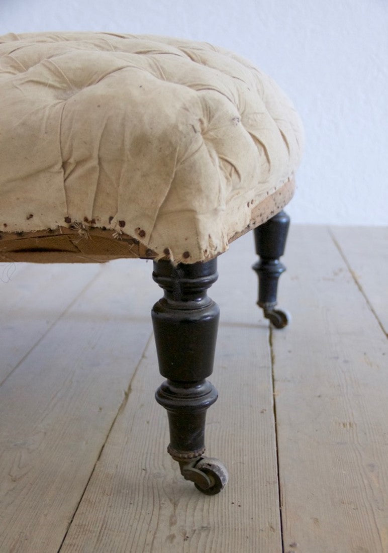 A buttoned slipper chair