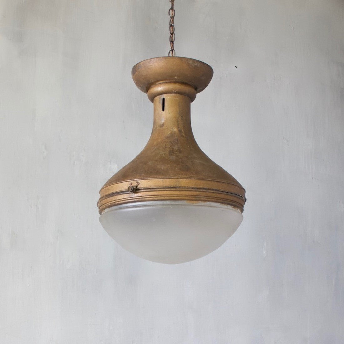 A spun copper pendant light