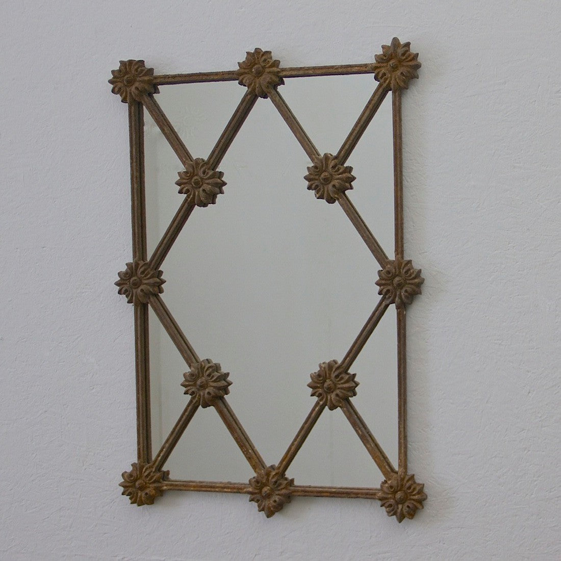 A C19th iron framed mirror.
