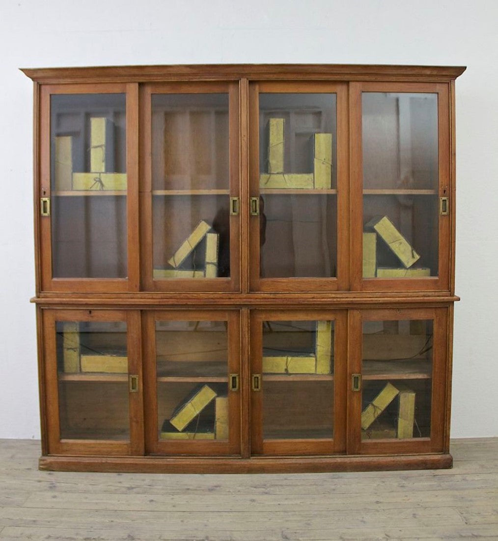 A C19th glazed pine cabinet