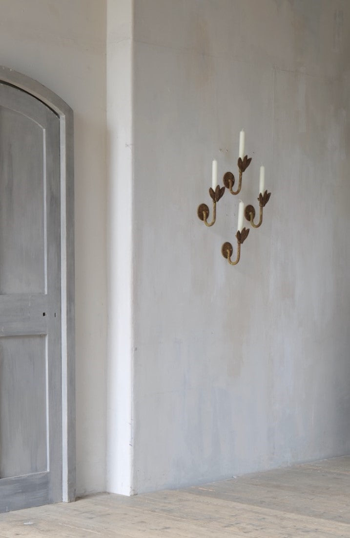 A set of four petal sconces
