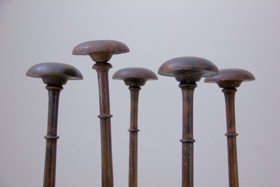 A collection of 5 ebonised hat stands