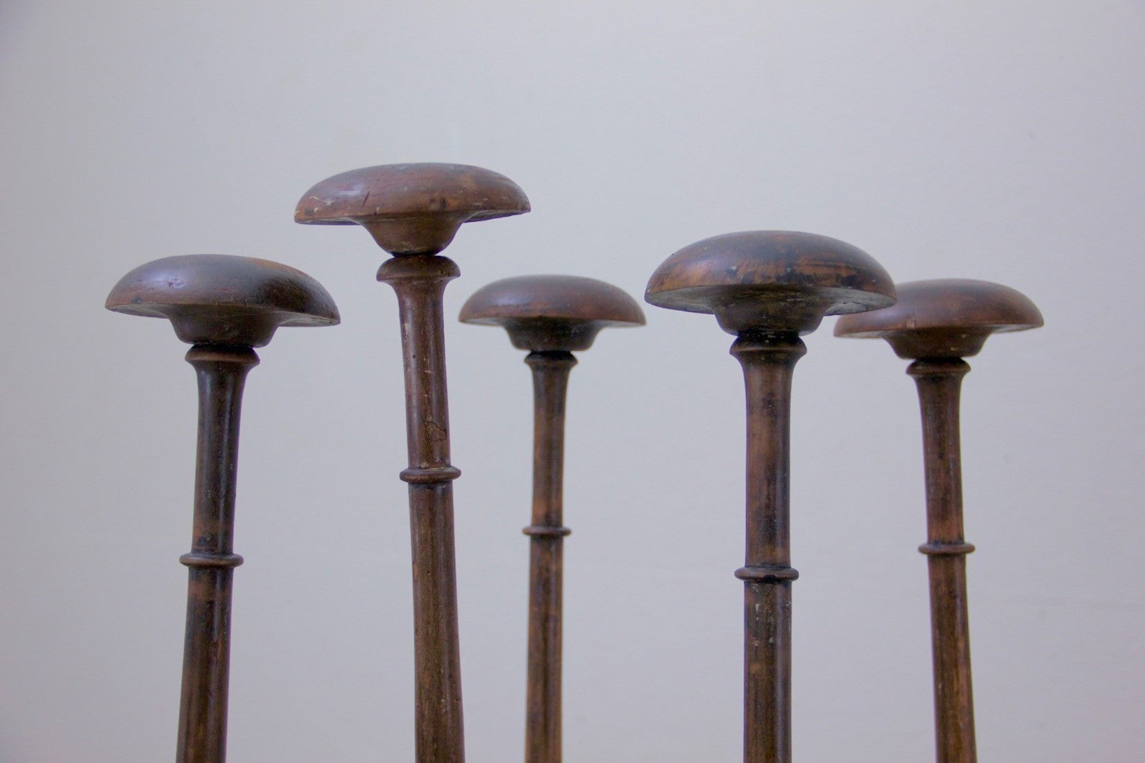 A collection of 5 ebonised hat stands