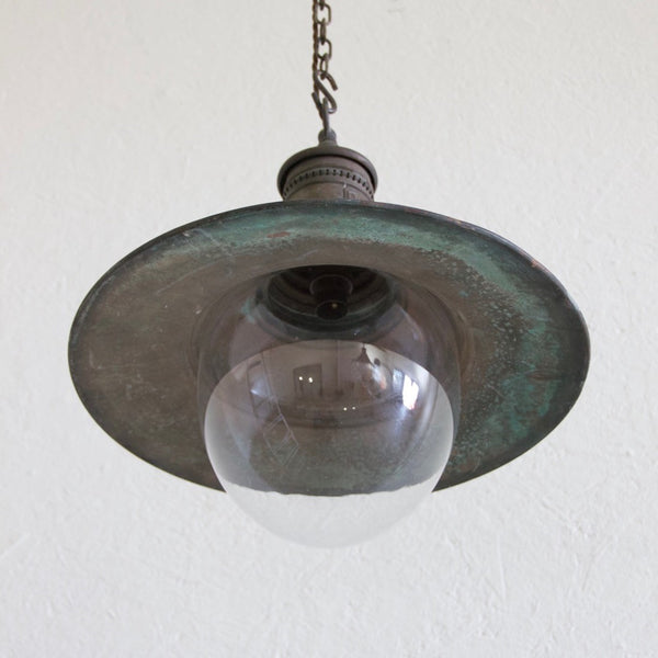A pair of copper pendant lights